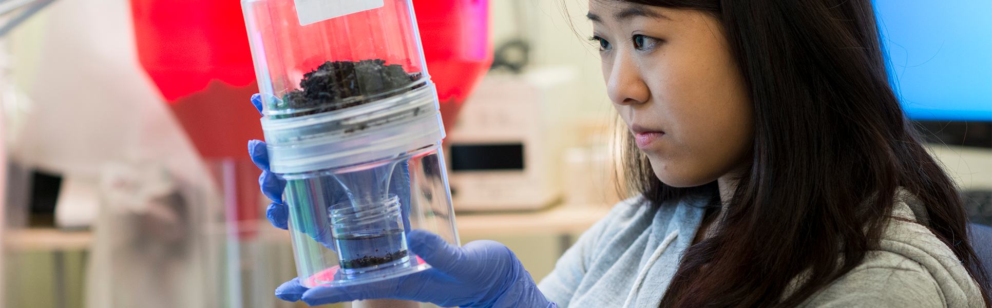 Student working with lab equipment.