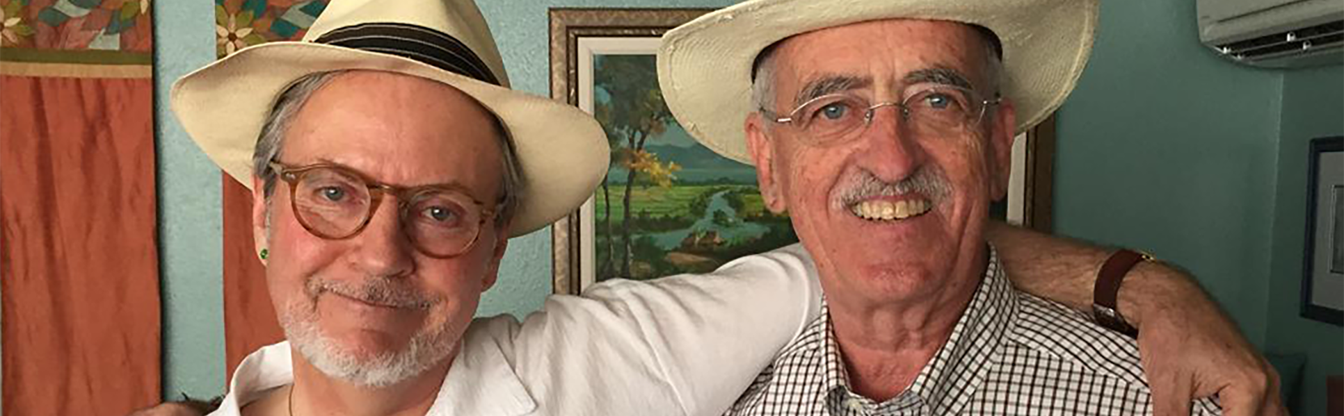 Frank Hilton and Alan Coogan posing in an embrace