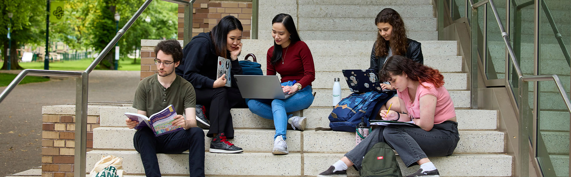 Group of students studying together on campus