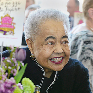 Evelyn Crowell smiling with flowers